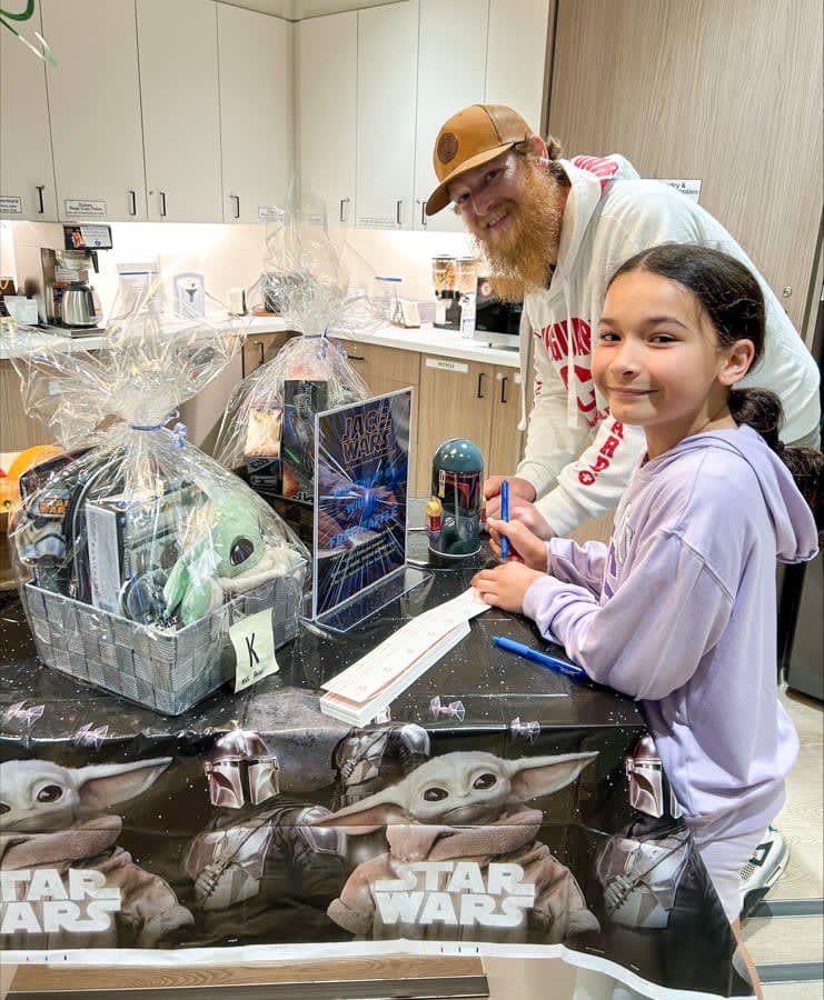 Rob Mashford and his daughter visit the Ronald McDonald House Family Room during Star Wars Day on May 4.